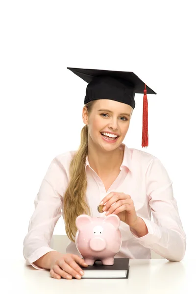 Estudante com banco porquinho — Fotografia de Stock