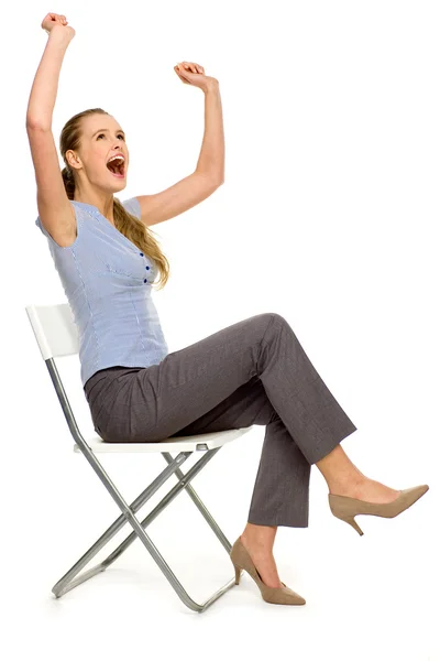 Femme assise sur une chaise Image En Vente