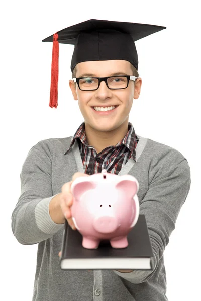 Estudante segurando porquinho banco — Fotografia de Stock