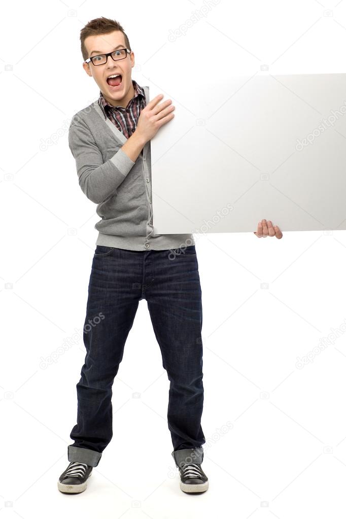 Casual young man with blank sign