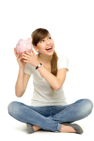 Joven mujer holding piggybank —  Fotos de Stock