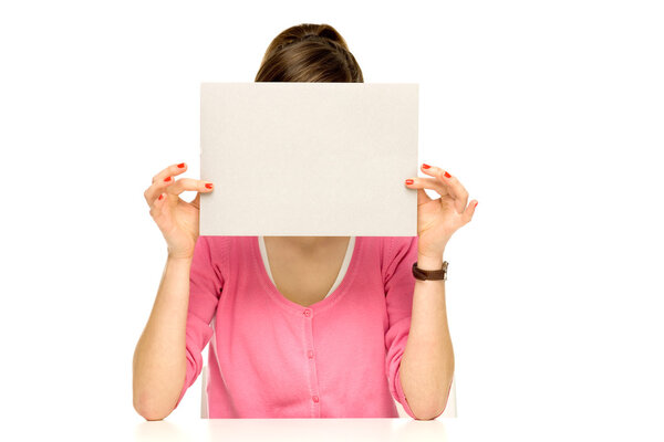 Young woman with blank poster