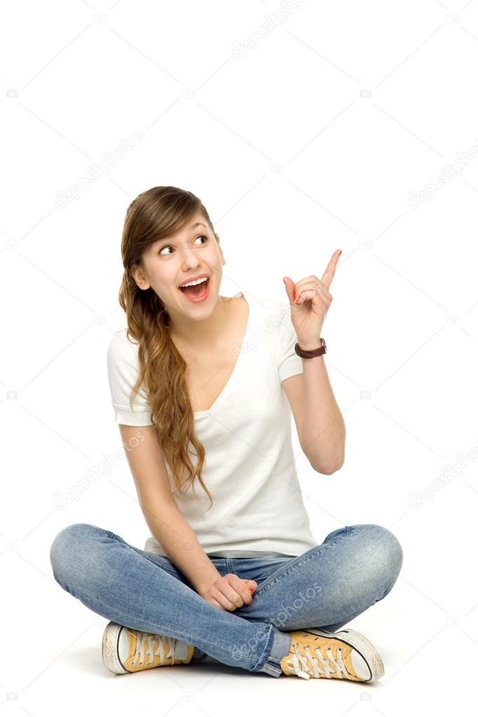 Young woman pointing up