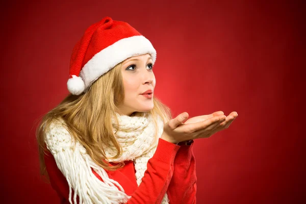 Santa woman blowing — Stock Photo, Image