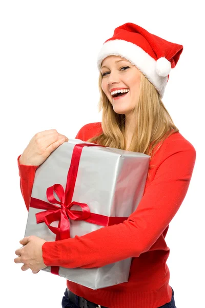 Frau im Weihnachtsmannhut mit Geschenken lizenzfreie Stockbilder