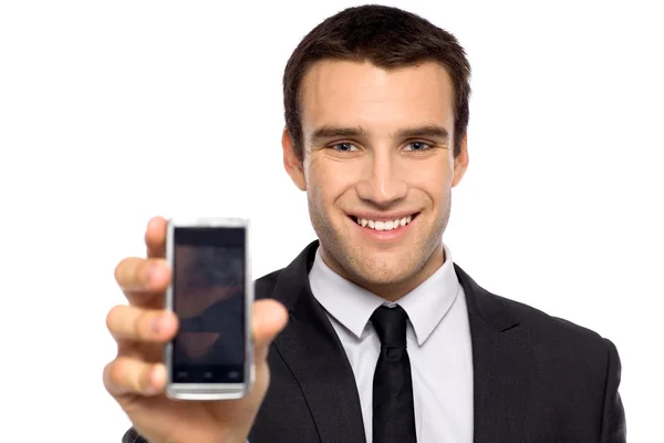 Businessman showing his mobile phone — Stock Photo, Image