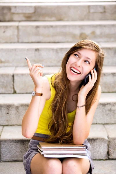 Girl sitting on stairs — Stock Photo, Image