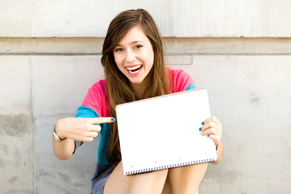 Teenage girl pointing finger — Stock Photo, Image