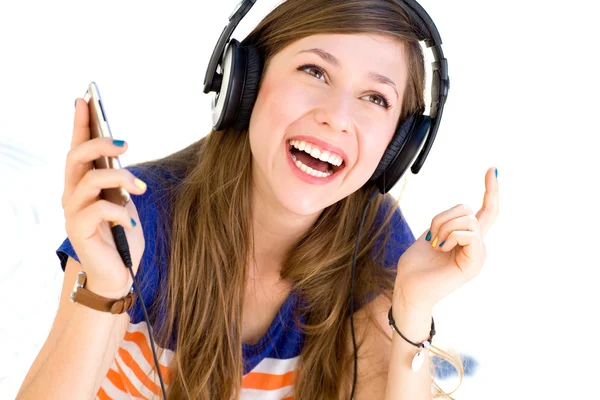 Young woman listening to music Royalty Free Stock Images