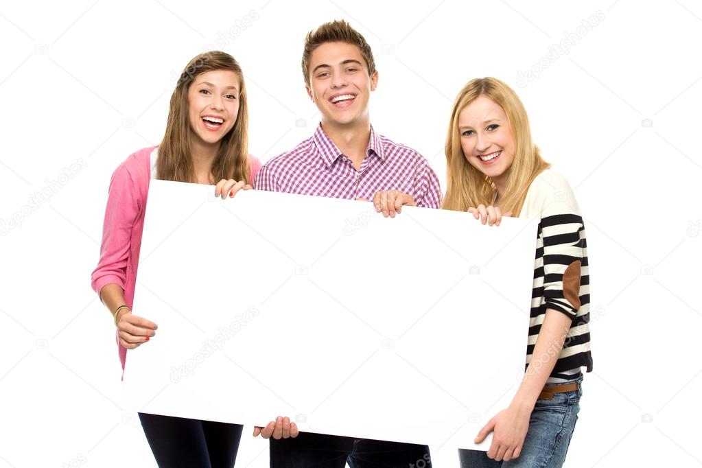 Three young holding blank poster