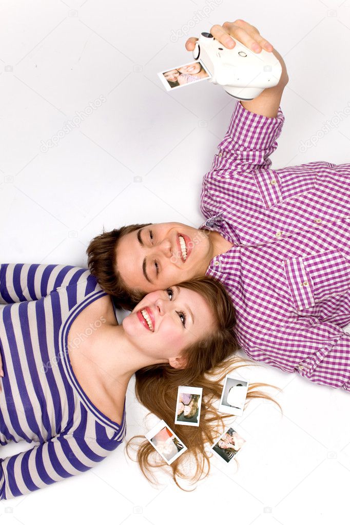 Young couple with instant camera