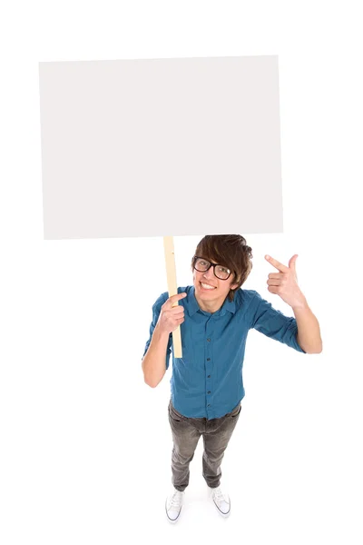 Joven sosteniendo cartel en blanco — Foto de Stock