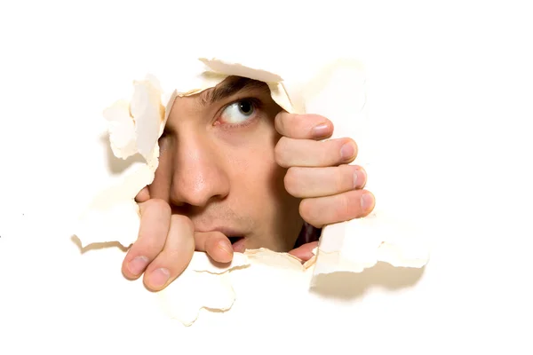 Looking through paper hole — Stock Photo, Image