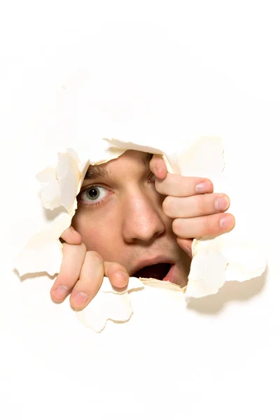 Looking through paper hole — Stock Photo, Image