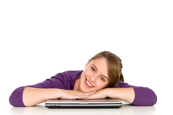 Girl leaning on table with laptop — Stock Photo, Image