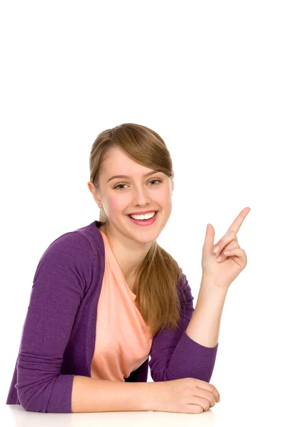 Genç kadın işaret ediyor — Stok fotoğraf