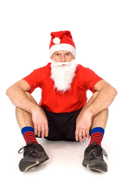 圣诞老人帽子坐的人 免版税图库照片