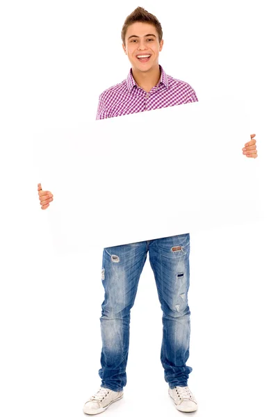 Jovem segurando cartaz em branco — Fotografia de Stock