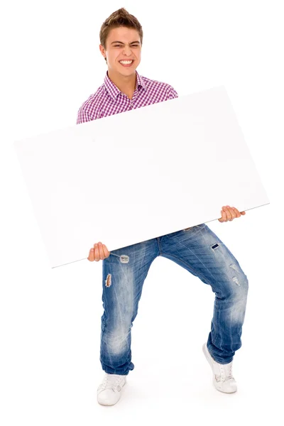 Young man holding blank poster — Stock Photo, Image