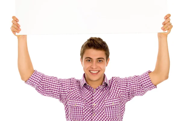 Young man holding blank poster — Stock Photo, Image