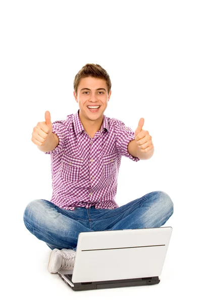 Man with laptop showing thumbs up Stock Picture