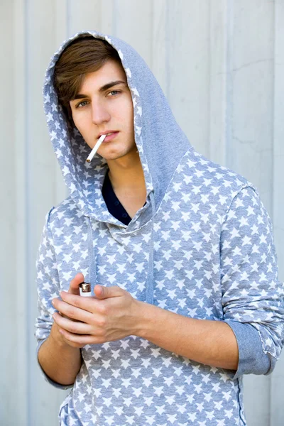 Young Man Lighting A Cigarette — Stock Photo, Image