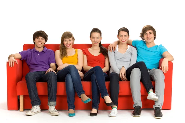 Friends sitting on couch — Stock Photo, Image