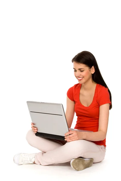 Teenage girl sitting with laptop — Stock Photo, Image