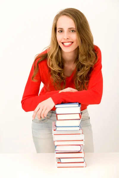 Tonårsflicka med trave böcker — Stockfoto
