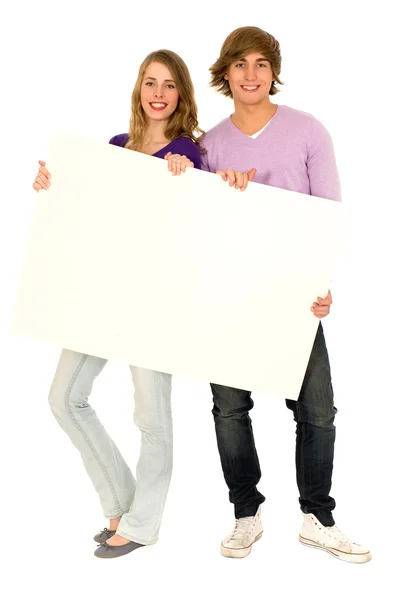 Νεαρό ζευγάρι, κρατώντας μια πινακίδα — Φωτογραφία Αρχείου