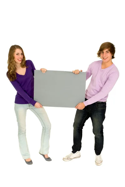 Couple holding blank sign — Stock Photo, Image