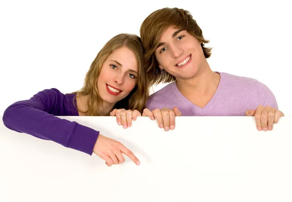 Young couple holding a billboard Stock Image