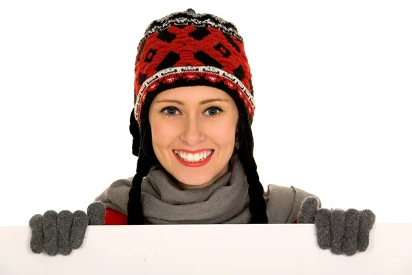 Woman in winter clothing holding a billboard Stock Photo