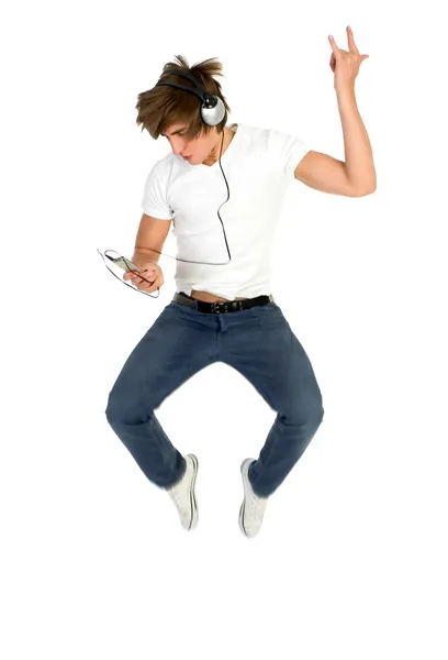 Young man jumping with MP3 player — Stock Photo, Image