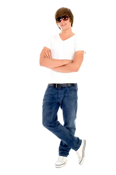 Young man standing with his arms folded — Stok fotoğraf