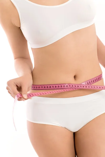 Woman with tape measure around her waist — Stock Photo, Image