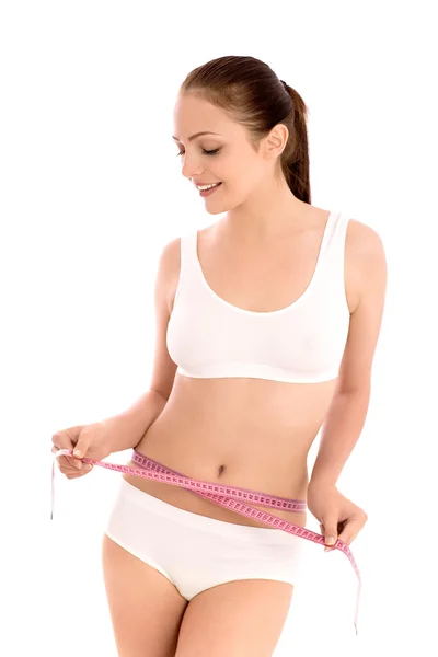 Woman measuring her waist — Stock Photo, Image