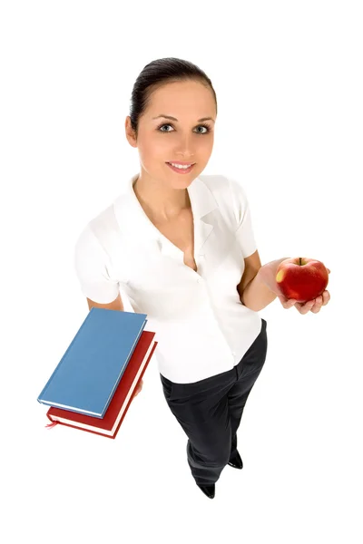 Female teacher holding books — Stock fotografie