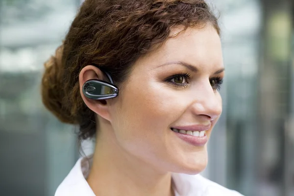 Businesswoman wearing headset — Stock Photo, Image