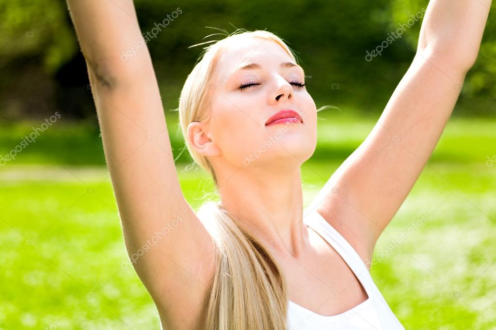 Woman with arms raised — Stock Photo © pikselstock 28262347