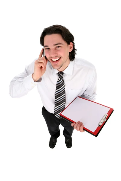 Empresário segurando prancheta, sorrindo — Fotografia de Stock