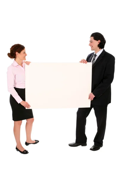 Business couple holding blank poster board — Φωτογραφία Αρχείου