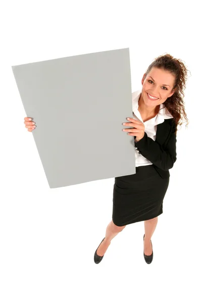 Empresária segurando cartaz em branco — Fotografia de Stock