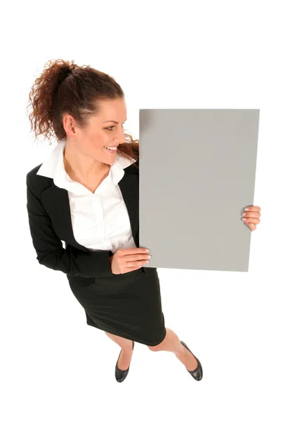 Empresária segurando cartaz em branco — Fotografia de Stock