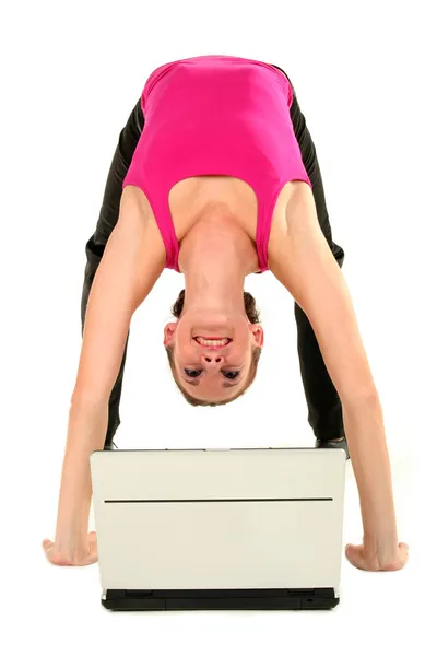 Woman bending over backwards and using laptop — Stock Photo, Image