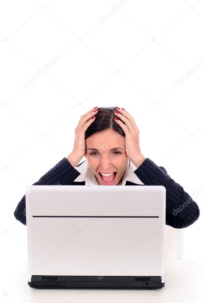 Businesswoman in shock while using laptop