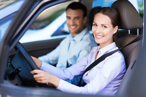 Young couple sitting in car Royalty Free Stock Photos