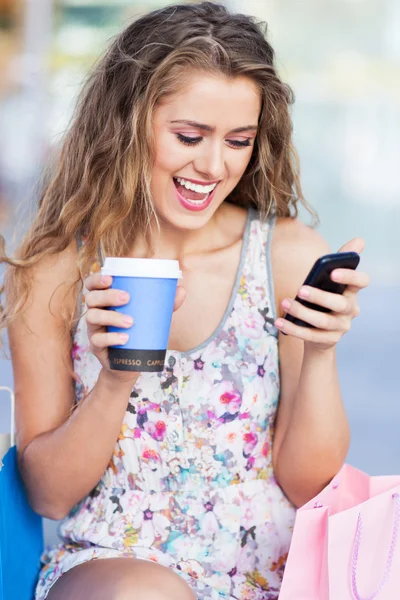 Woman having a break from shopping — Stock Photo, Image