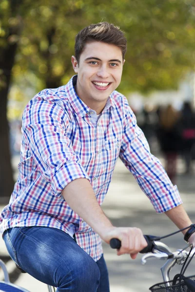 Young man on bike — Stock Photo, Image