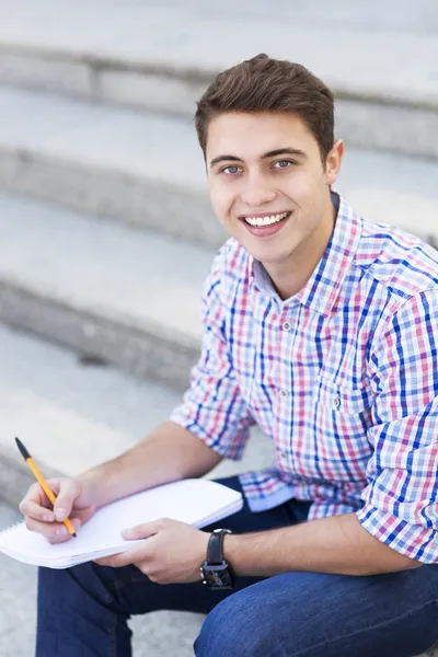 Male student smiling — Stock Photo, Image